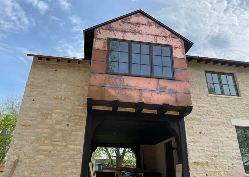 Copper metal panel facade on a stone building for Skylight Installation in Litchfield Park