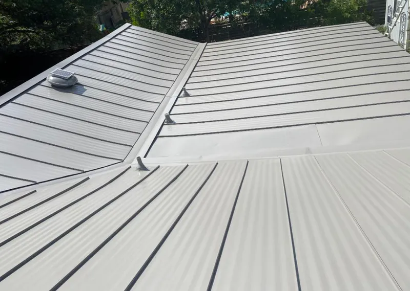 Solar attic fan installed on a metal roof for Roof Ventilation in Litchfield Park